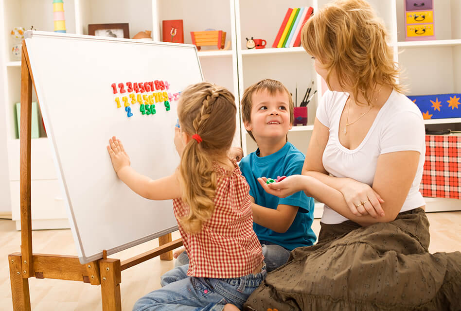 Nanny teaching children numbers